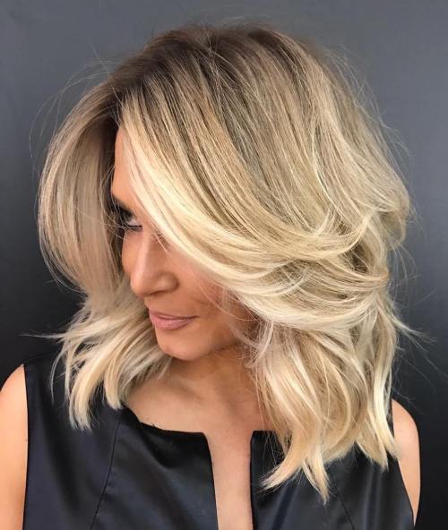 Lang geschichteter blonder Balayage Lob