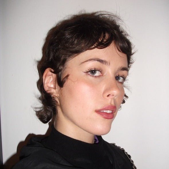 6. getousled Dark Pixie mit Mini -Fransen (Pixie -Haarschnitte mit Pony)